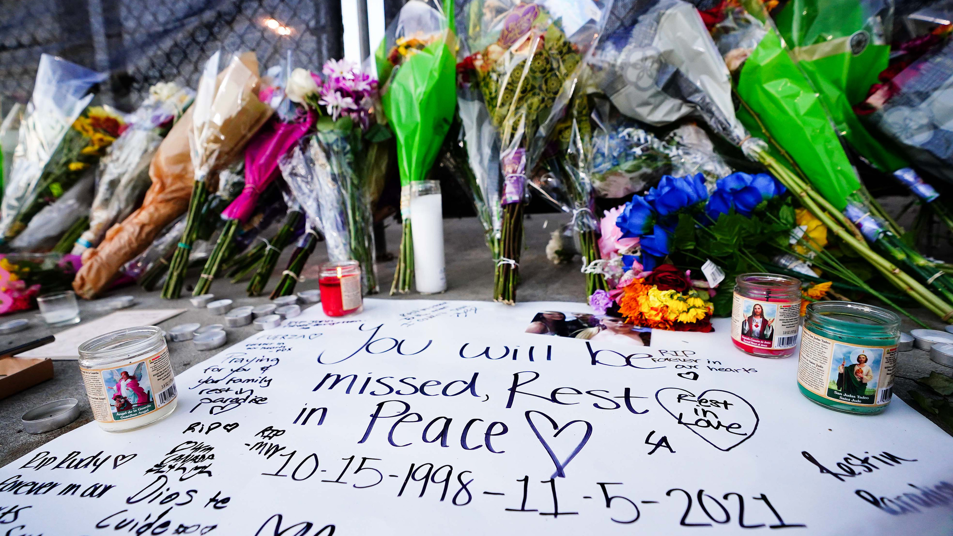 Candles, flowers and letters are placed at a memorial outside of the canceled Astroworld festival at NRG Park on Nov. 7, 2021, in Houston. According to authorities, eight people died and 17 people were taken to local hospitals after what was described as a crowd surge at the Astroworld festival, a music festival started by Houston-native rapper and musician Travis Scott in 2018.