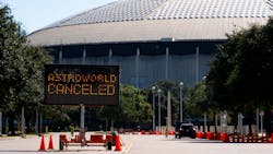 A street sign shows the cancellation of the Astroworld Festival at NRG Park in Houston on Saturday. According to authorities, eight people died and 17 people were taken to local hospitals after what they describe as a crowd surge at the Astroworld festival, a music festival started by Houston-native rapper and musician Travis Scott in 2018.