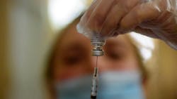 Pharmacist Tara Hubbard prepares a COVID-19 vaccination in hallway of The Retreat, a Community Renewal Team assisted-living facility in Hartford, CT, on Jan. 15. Pharmacist Tara Hubbard prepares a COVID-19 vaccination in hallway of The Retreat, a Community Renewal Team assisted-living facility in Hartford, CT, on Jan. 15.