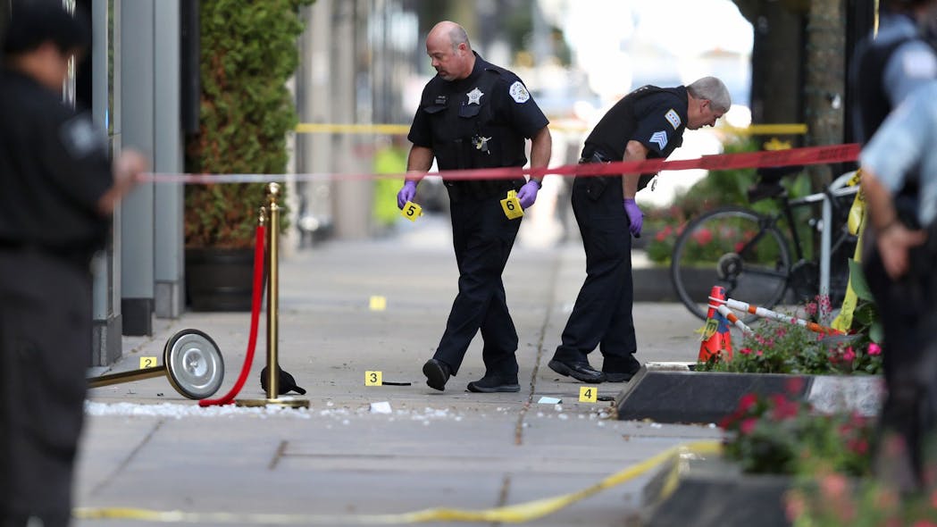 Chicago police investigate a shooting at first block of East Oak Street in the Gold Coast neighborhood on August 2020.