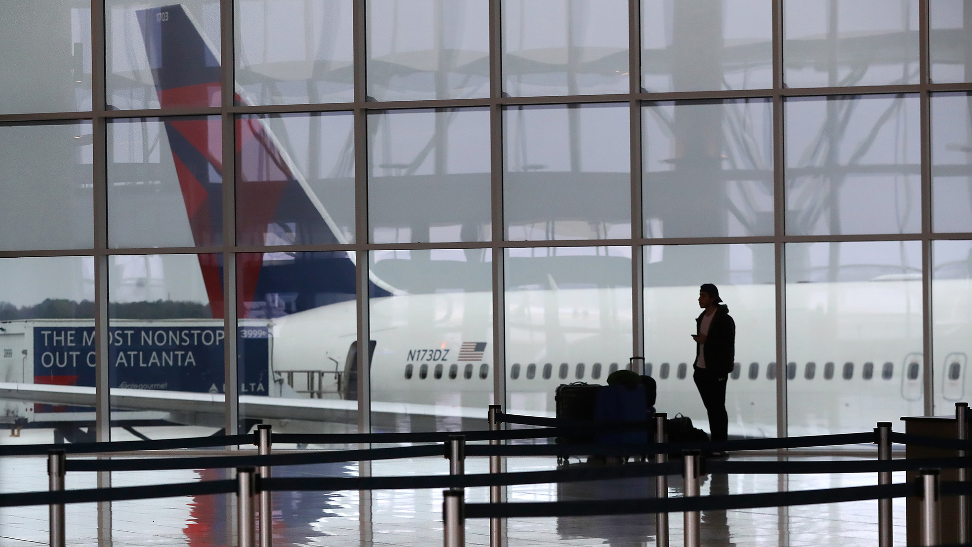 A Delta plane sits at the International Terminal at Atlanta's Hartsfield-Jackson International Airport in March 2020.
