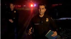 Houston Assistant Police Chief Yasar Bashir (right) talks to reporters early Sunday about a shooting at a Halloween party that killed one woman and injured three other teens.