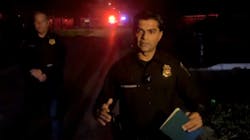 Houston Assistant Police Chief Yasar Bashir (right) talks to reporters early Sunday about a shooting at a Halloween party that killed one woman and injured three other teens.