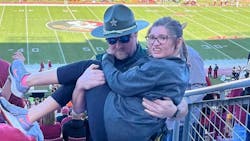 A Leon County, FL, sheriff's deputy carried a young woman struggling to reach her seat during the Florida State-Miami game Nov. 13 at Doak Campbell Stadium in Tallahassee. A Leon County, FL, sheriff's deputy carried a young woman struggling to reach her seat during the Florida State-Miami game Nov. 13 at Doak Campbell Stadium in Tallahassee.