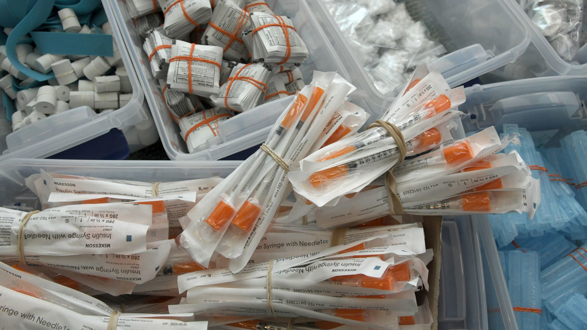 Sterile drug paraphernalia supplies given to drug users as a public health measure include (clockwise from lower left): syringes; non-latex ties; alcohol wipes; cottons, which filter out larger particles from drug solutions; cookers; and sterile water ampules.