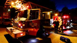 Two Montville, CT, police officers got on top of their cruiser to rescue a boy hanging out of a second-story window of a burning apartment building Friday. Two Montville, CT, police officers got on top of their cruiser to rescue a boy hanging out of a second-story window of a burning apartment building Friday.