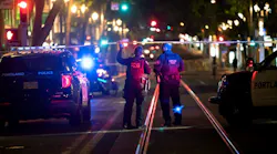 Police investigate a July 24 shooting in downtown Portland, OR, near Southwest Fifth Avenue and Washington Street.