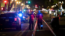 Police investigate a July 24 shooting in downtown Portland, OR, near Southwest Fifth Avenue and Washington Street.