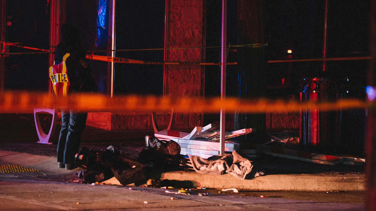 Debris litters the street at a crime scene Sunday in Waukesha, WI, where an SUV drove through pedestrians at a holiday parade.