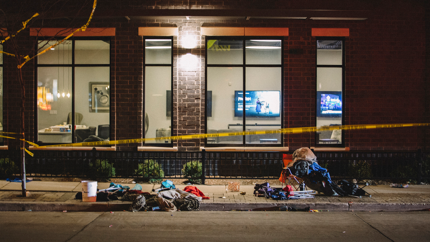 Debris litters the street at a crime scene Sunday in Waukesha, WI. According to reports, an SUV drove through pedestrians at a holiday parade, killing at least one and injuring 20 more.