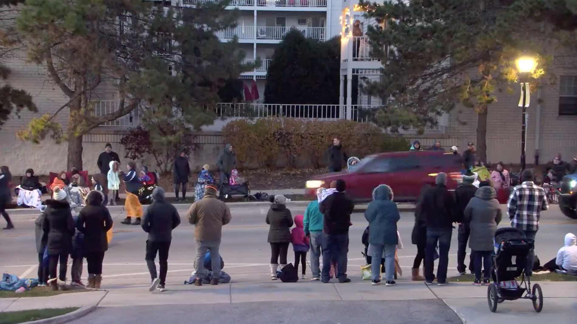 In an image captured from a video posted by the City of Waukesha, WI, on Facebook, a vehicle speeds through the Waukesha Christmas parade Sunday.
