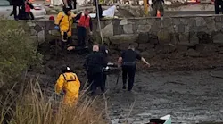 Westport, CT, police officers grabbed a nearby canoe to rescue a missing elderly man who was partially submerged in the cold waters off Saugatuck Shores Beach early Tuesday.