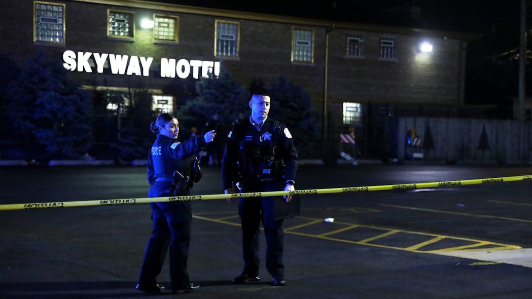 Chicago police investigate the scene outside the Skyway Motel at Stony Island and 92nd Street after a cop was shot on Dec. 1, 2021.