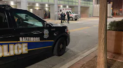 A Baltimore police cruiser is parked outside of Shock Trauma where an officer was being treated for multiple gunshot wounds following an ambush-style attack early Thursday.