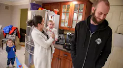 Farmington, CT, Police Officer James O'Donnell, who suffered significant injuries in September when he was hit by a driver fleeing a crime scene in a stolen car, hangs out at home with son Andrew (far left), wife Kris and daughter Saoirse.