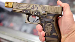 A worker shows off a Glock 19 Donald Trump commemorative 9mm pistol being offered for sale at Freddie Bear Sports in April in Tinley Park, IL. A worker shows off a Glock 19 Donald Trump commemorative 9mm pistol being offered for sale at Freddie Bear Sports in April in Tinley Park, IL.