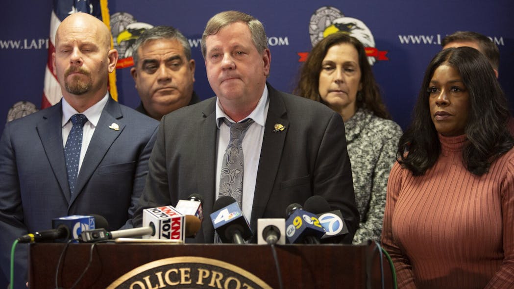 Craig Lally (center), president of the Los Angeles Police Protective League, speaks during a press conference at the Los Angeles Police Protective League in downtown Los Angeles on Dec. 4.