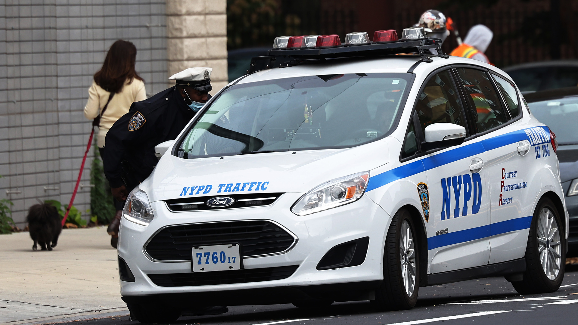 New York Police Department traffic officers have a conversation in October in downtown Brooklyn in New York City.