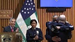 NYPD Harbor Officer Thomas Alexander hugs Sgt. William Gaspari, who donated a kidney on the offier's behalf. NYPD Harbor Officer Thomas Alexander hugs Sgt. William Gaspari, who donated a kidney on the offier's behalf.