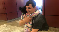 North Charleston, SC, Police Officer Jerrid Riley receives a hug from McKenna Delarosa, who he saved from choking in 2019.