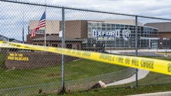 Flags wave at the rear entrance of Oxford, MI, High School on Dec. 2 after an active shooter situation Nov. 30 at the school that left four students dead and seven others with injuries. Flags wave at the rear entrance of Oxford, MI, High School on Dec. 2 after an active shooter situation Nov. 30 at the school that left four students dead and seven others with injuries.