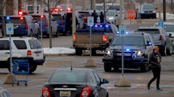 Michigan State Police and other law enforcement vehicles remained lined up at a business parking lot where students earlier had gathered following a shooting at Oxford High School on Tuesday. Michigan State Police and other law enforcement vehicles remained lined up at a business parking lot where students earlier had gathered following a shooting at Oxford High School on Tuesday.