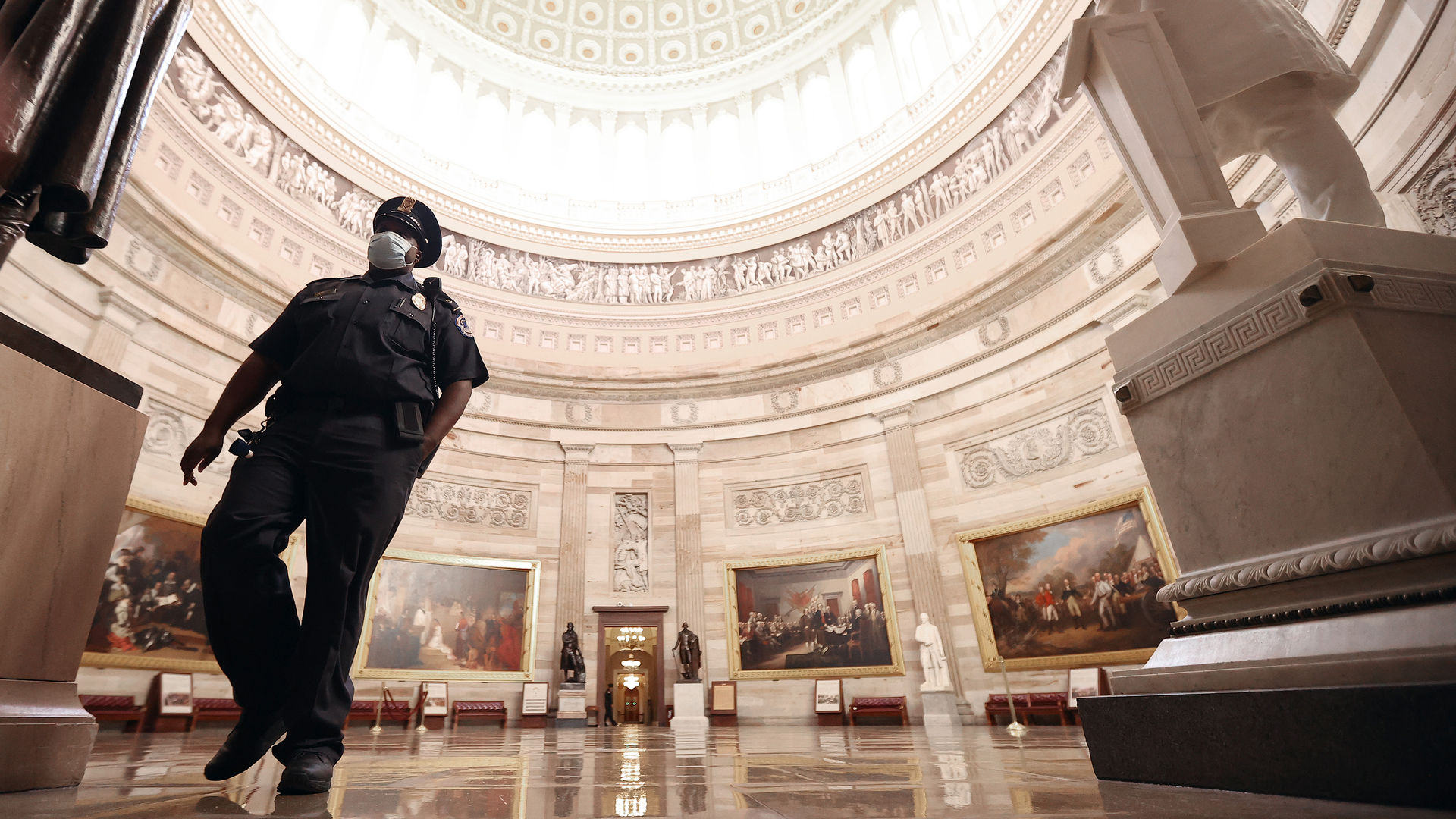 A U.S. Capitol Police officer helps evacuate the Rotunda during a drill Nov. 8 in Washington, D.C.