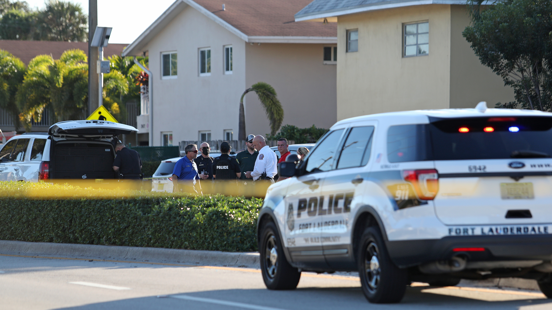 Law enforcement officials are seen after reports of two children being killed, and at least three others hospitalized after a hit-ad-run car crash in Wilton Manors, FL, on Monday.