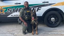 K-9 Deputy First Class Marcus Dawson is seen with his K-9 partner Baro K-9 Deputy First Class Marcus Dawson is seen with his K-9 partner Baro