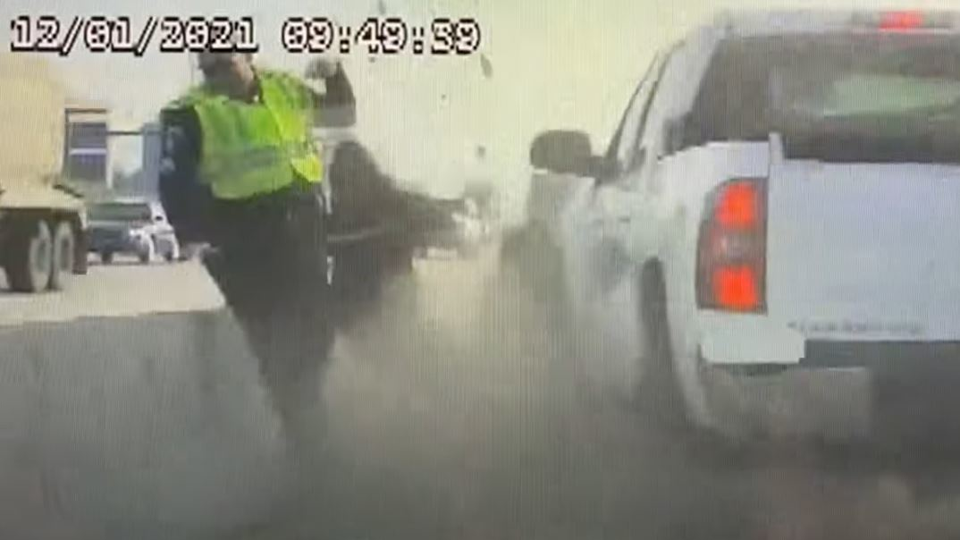 Newly released dashboard camera video shows an Idaho State Police trooper narrowly escape serious injury.