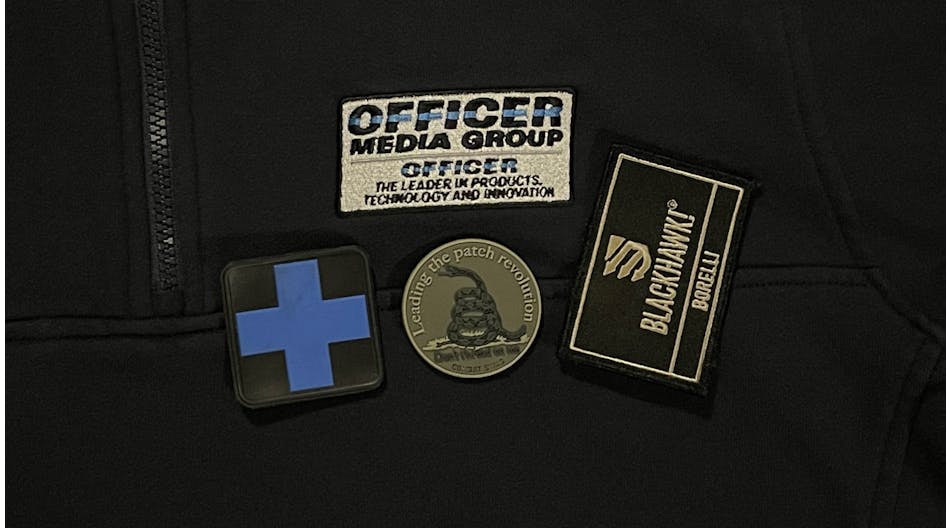 An embroidered shirt from 511 Tactical, challenge coin from Combat Swag and a personalized patch from BLACKHAWK. Examples of marketing materials.