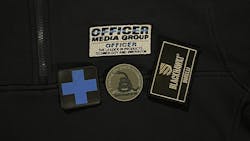 An embroidered shirt from 511 Tactical, challenge coin from Combat Swag and a personalized patch from BLACKHAWK. Examples of marketing materials. An embroidered shirt from 511 Tactical, challenge coin from Combat Swag and a personalized patch from BLACKHAWK. Examples of marketing materials.