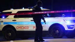 A Chicago police officer walks past a puddle of blood at the scene of a fatal shooting Friday. An 18-year-old male was shot in the neck by an unknown offender, according to police. A Chicago police officer walks past a puddle of blood at the scene of a fatal shooting Friday. An 18-year-old male was shot in the neck by an unknown offender, according to police.