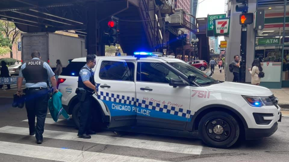 Chicago police officers respond to a battery in progress inside a local business in October.