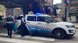Chicago police officers respond to a battery in progress inside a local business in October.