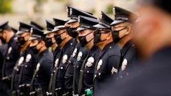 LAPD officers attend the funeral of Officer Valentin Martinez, the agency’s first sworn employee to die from COVID-19, in August 2020. LAPD officers attend the funeral of Officer Valentin Martinez, the agency’s first sworn employee to die from COVID-19, in August 2020.