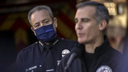 LAPD Chief Moore (left) watches as Mayor Eric Garcetti addresses a press conference held at Los Angeles Fire Station 3 on Thursday. LAPD Chief Moore (left) watches as Mayor Eric Garcetti addresses a press conference held at Los Angeles Fire Station 3 on Thursday.