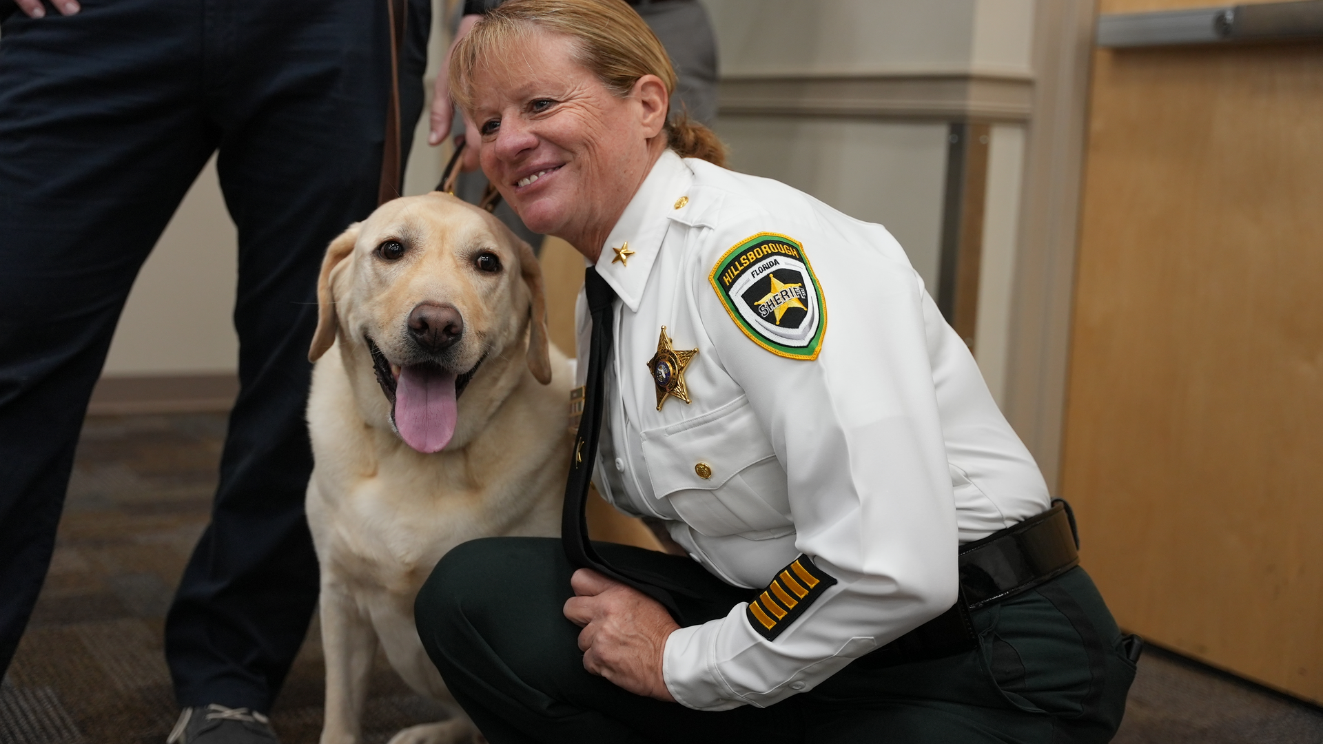 Mason Star, Hillsborough County Sheriff's Office new emotional support dog, gets some petting time with his handler, Chief Deputy Donna Lusczynski.