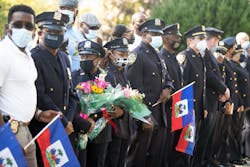 NYPD officers line the street outside Lt. Yvan Pierre Louis' home when he returned after a five-month hospitalization with COVID-19. NYPD officers line the street outside Lt. Yvan Pierre Louis' home when he returned after a five-month hospitalization with COVID-19.
