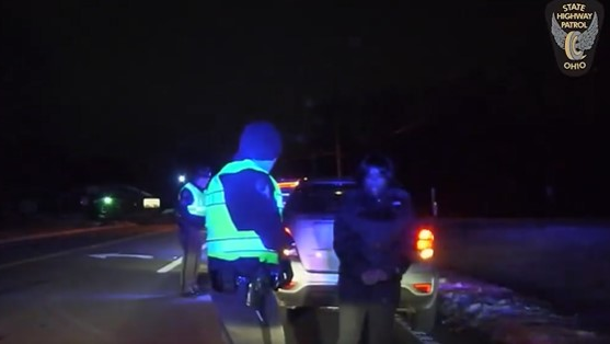 An alleged impaired and distracted driver was taken into custody after she crashed into an Ohio Highway Patrol cruiser during a traffic stop in Portage County on Thursday, nearly hitting a trooper.