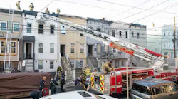 The Jersey City, NJ, Fire Department responds to a four-alarm fire that destroyed five three-story row houses Friday.