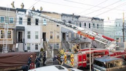 The Jersey City, NJ, Fire Department responds to a four-alarm fire that destroyed five three-story row houses Friday. The Jersey City, NJ, Fire Department responds to a four-alarm fire that destroyed five three-story row houses Friday.