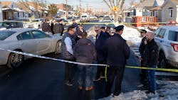 NYPD officers investigate a shooting on Avenue L and East 98th Street in Brooklyn on Feb. 1. NYPD officers investigate a shooting on Avenue L and East 98th Street in Brooklyn on Feb. 1.