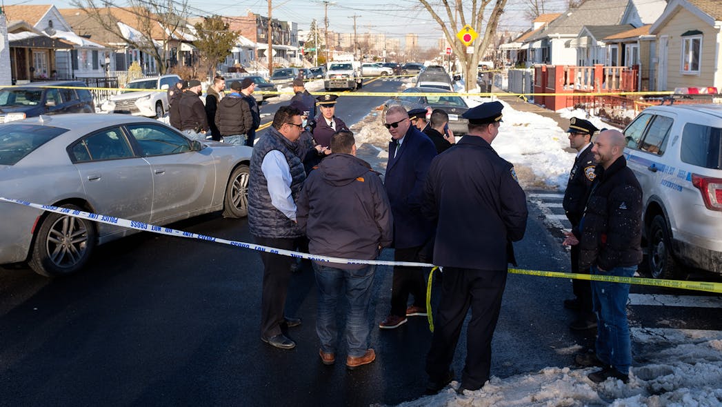 NYPD officers investigate a shooting on Avenue L and East 98th Street in Brooklyn on Feb. 1.