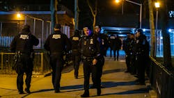 NYPD officers and detectives investigate the scene after an off-duty officer was shot in the foot near the entrance to a building in the Manhattanville Houses on Saturday. NYPD officers and detectives investigate the scene after an off-duty officer was shot in the foot near the entrance to a building in the Manhattanville Houses on Saturday.