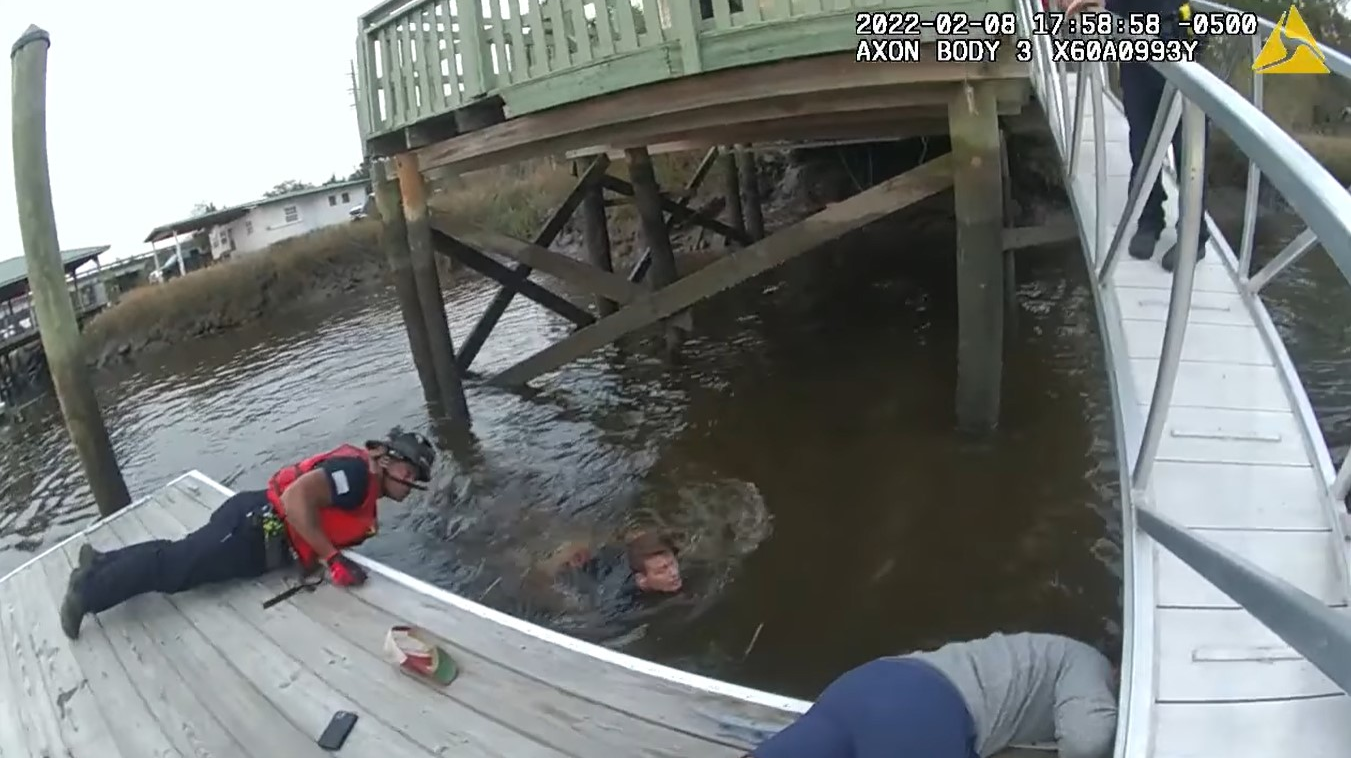 Watch Ga. Officers Leap into River to Save Woman Trapped Under Dock Officer