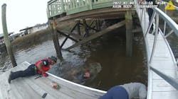Two Savannah, GA, police officers leaped into a river to rescue a woman who plunged into the water and was trapped under a dock Tuesday.