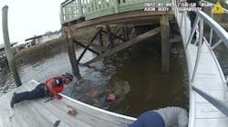 Two Savannah, GA, police officers leaped into a river to rescue a woman who plunged into the water and was trapped under a dock Tuesday. Two Savannah, GA, police officers leaped into a river to rescue a woman who plunged into the water and was trapped under a dock Tuesday.