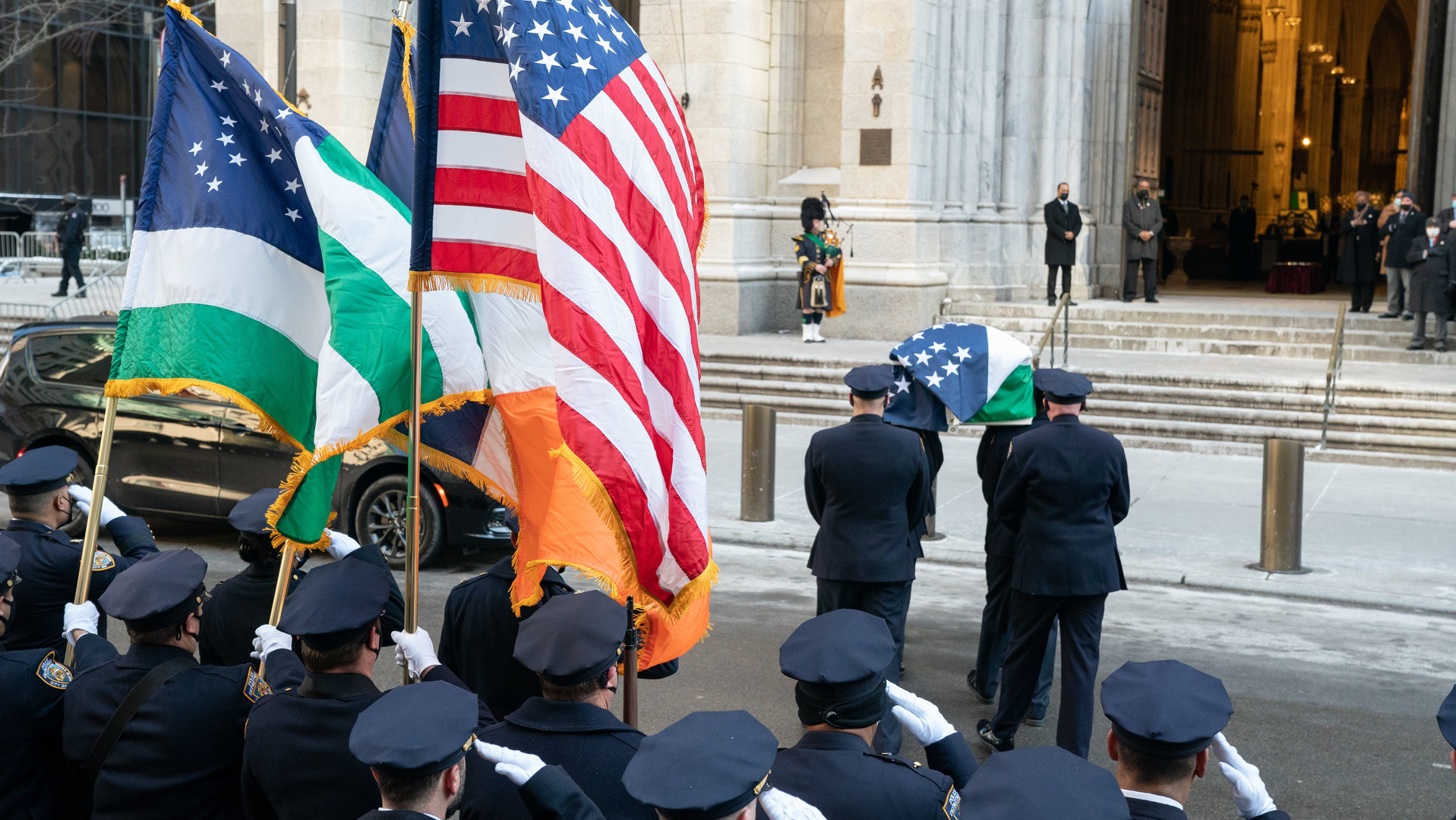 NYPD Officer Wilbert Mora's casket arrives at St. Patrick's Cathedral for the officer's wake on Tuesday.