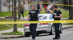 Baltimore police officers investigate a shooting scene near McCulloh and Wilson streets on Friday, March 18.